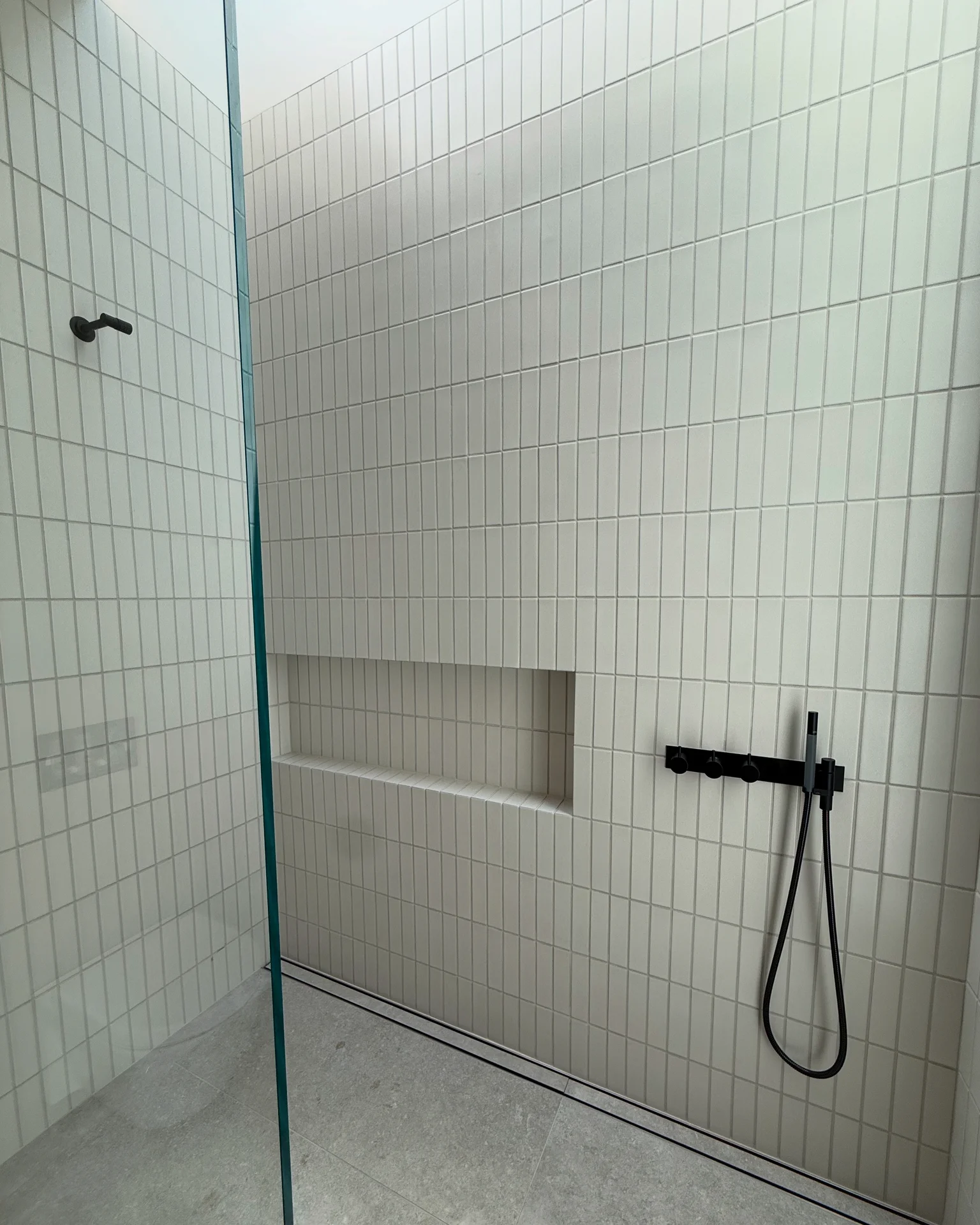 Contemporary bathroom with toilet, sink, and bathtub